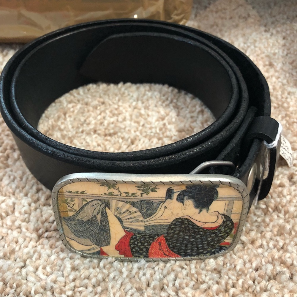 Leather belt with Asian theme buckle
